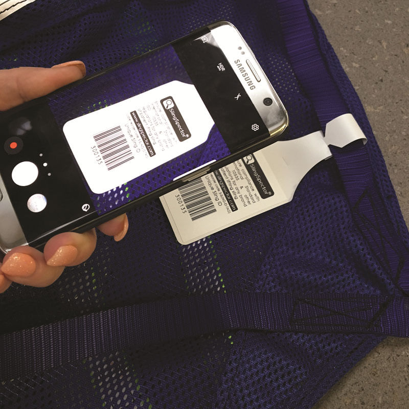 sling-id-barcode-being-scanned.jpg